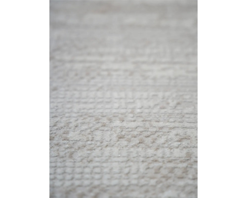 Prim-plan cu un covor deschis la culoare cu textură