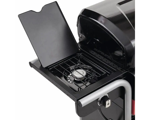 Imagine detaliată cu un grătar pe gaz cu arzător lateral și capac deschis