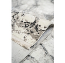 Vizualizare detaliată a unui covor cu model abstract