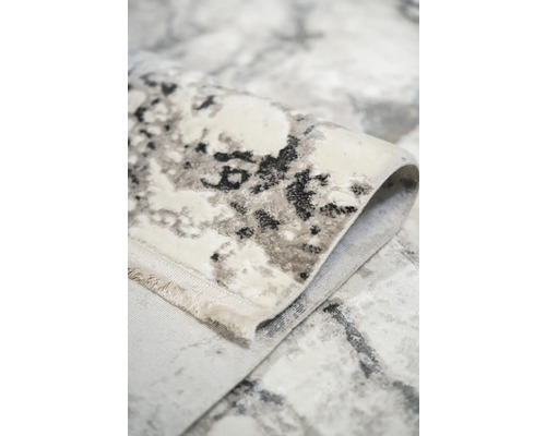 Vizualizare detaliată a unui covor cu model abstract