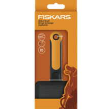 Perie de netezire Fiskars pentru câini și pisici în ambalajul produsului