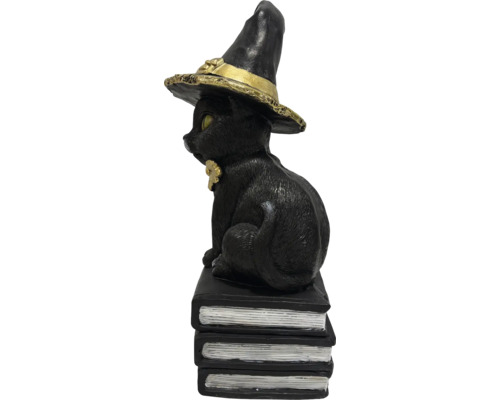 Figurină decorativă pisică neagră cu pălărie de vrăjitoare pe o grămadă de cărți