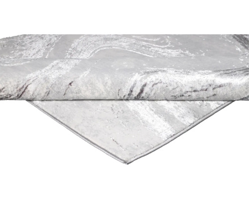 Prim-plan al unui covor gri cu model abstract