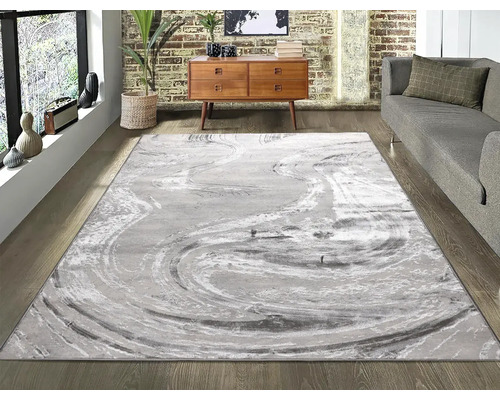 Living cu covor abstract, canapea și comodă