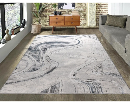 Covor modern cu model abstract într-un living.