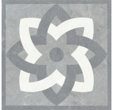 Placă ceramică pătrată cu model geometric în formă de stea cu aspect de piatră și bordură decorativă.