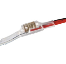 Conector de mufare transparent cu tub termocontractabil pentru cabluri electrice.