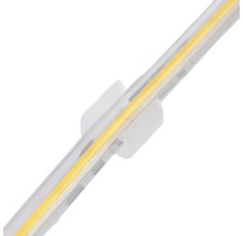 Bandă LED COB cu clip de montare din plastic transparent.