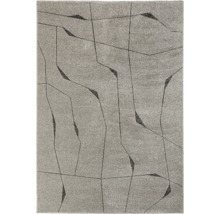 Covor cu model geometric abstract din linii fine și suprafețe contrastante.