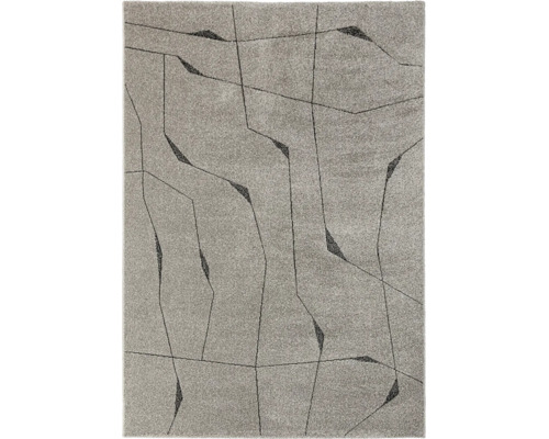 Covor cu model geometric abstract din linii fine și suprafețe contrastante.