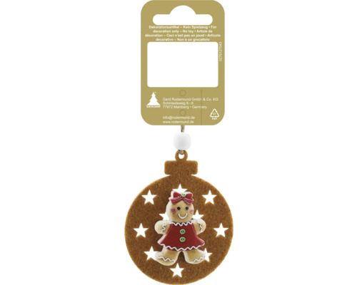 Ornament de Crăciun pentru brad cu o figurină fetiță de turtă dulce pe un cerc de pâslă maro cu decupaje de stele. Ornament de Crăciun pentru brad cu o figurină fetiță de turtă dulce pe un cerc de pâslă maro cu decupaje de stele.