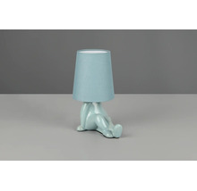 Lampă de masă albastru deschis cu bază sub formă de figură șezândă din ceramică și abajur din material textil