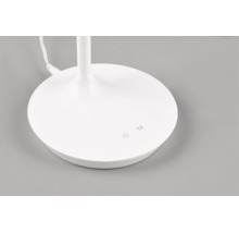 Baza rotundă a unei lămpi de birou albe cu butoane tactile pentru pornire, oprire și selectarea modului.