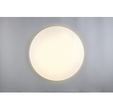 Plafonieră rotundă cu LED, cu efect de cer înstelat și lumină albă caldă.