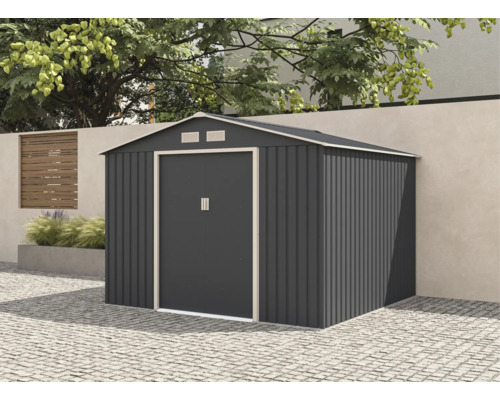 Șopron de grădină modern din metal antracit cu acoperiș în două pante și ușă dublă, amplasat pe un pavaj în fața unui zid de grădină.
