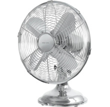 Ventilator de masă din metal cromat de la Nordic Home cu grilaj de protecție și patru palete.