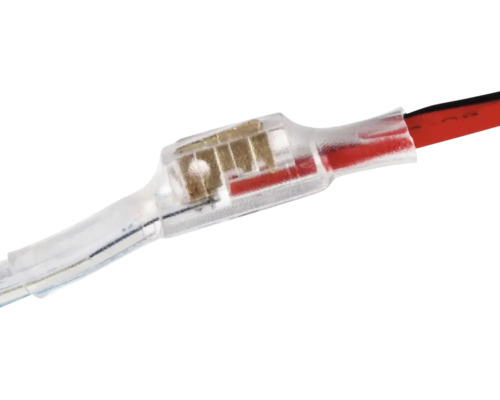 Conector de lipit termocontractabil transparent pentru conectarea a două cabluri.