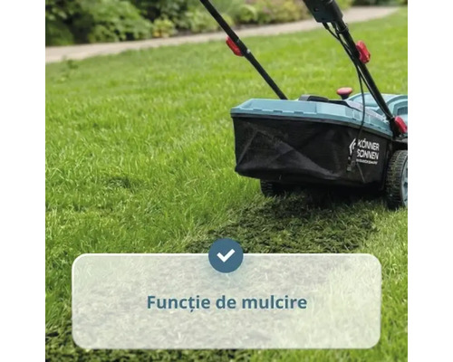 Mașină de tuns iarba cu funcție de mulcire în acțiune pe gazon.