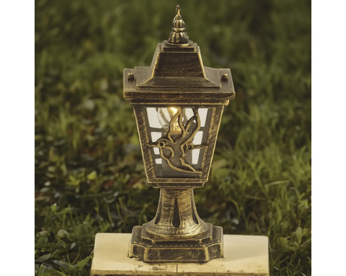 Lanternă solară de grădină cu aspect de bronz și motiv cu pasăre pe sticlă.