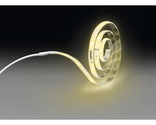 Bandă LED flexibilă Philips, rulată în formă de spirală și aprinsă, cu lumină albă caldă și spate autoadeziv.
