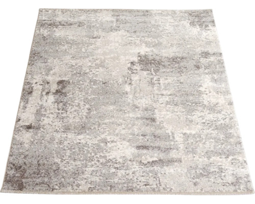 Covor dreptunghiular cu model abstract modern în nuanțe de gri și alb pestriț.