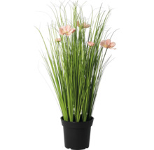 Iarbă artificială cu flori roz în ghiveci negru.