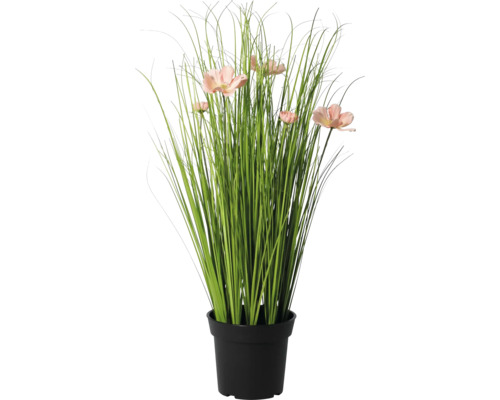 Iarbă artificială cu flori roz în ghiveci negru.