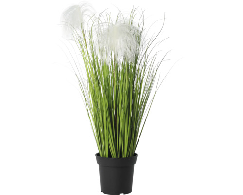 Iarbă decorativă artificială în ghiveci de plastic negru cu inflorescențe albe.