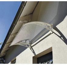 Copertină de ușă curbată cu panou transparent și suporturi laterale decorative montată pe peretele casei.