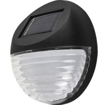 Aplică solară de exterior rotundă cu panou solar integrat și difuzor translucid striat.
