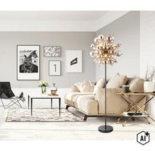 Lampadar modern cu globuri din sticla intr-un living cu canapea, masuta de cafea si decoratiuni de perete. (Image AI modified or generated)