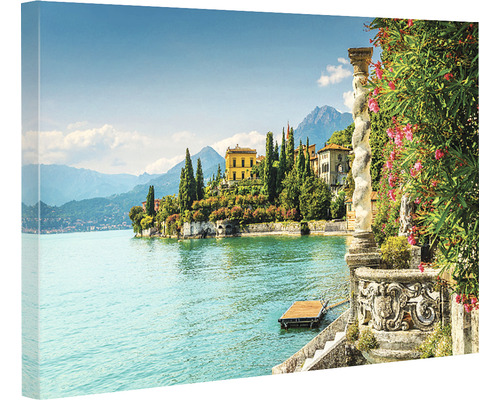 Tablou pe pânză cu un peisaj pitoresc cu un lac, case și munți