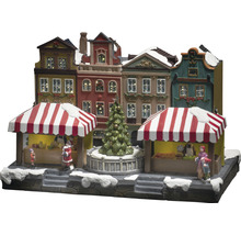 Scenă de piață de Crăciun cu case și figurine iluminate