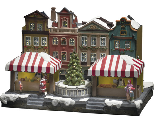 Scenă de piață de Crăciun cu case și figurine iluminate