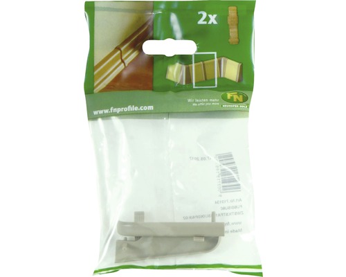 Două colțare pentru plinte într-un ambalaj din plastic.