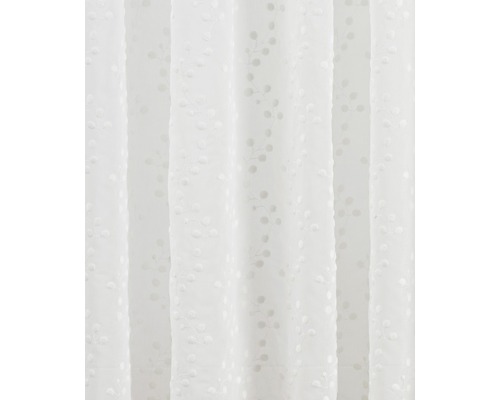 Prim-plan cu o draperie cu model floral.