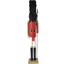 Spărgător de nuci decorativ cu halat roșu, pălărie neagră și bază aurie.