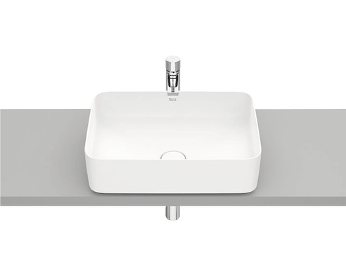 Lavoar ceramic de blat cu baterie pe un raft
