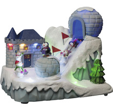 Peisaj decorativ de iarnă cu castel, iglu, pinguini, oameni de zăpadă și schiori