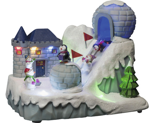 Peisaj decorativ de iarnă cu castel, iglu, pinguini, oameni de zăpadă și schiori