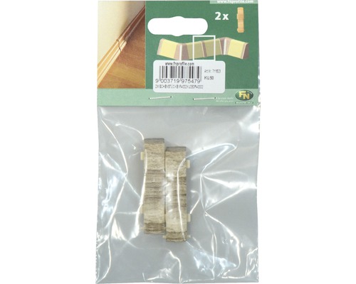 Două elemente de colț pentru plinte într-un ambalaj.