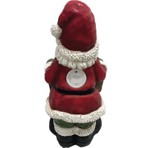 Vedere din spate a unei figurine Moș Crăciun cu compartiment pentru baterii