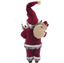 Vedere din spate a unei figurine de Crăciun Moș Crăciun cu un sac de cadouri