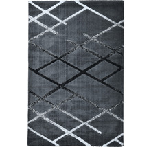 Covor cu model geometric în romburi