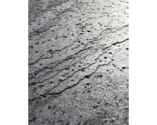 Prim-plan al unei suprafețe de ardezie închisă la culoare, cu un finisaj texturat