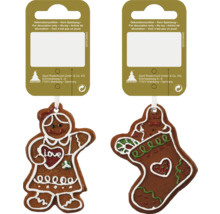 Două ornamente de turtă dulce ca decorațiuni pentru perioada Crăciunului.