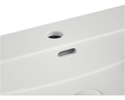 Imagine detaliată a unei chiuvete cu orificiu pentru robinet și preaplin