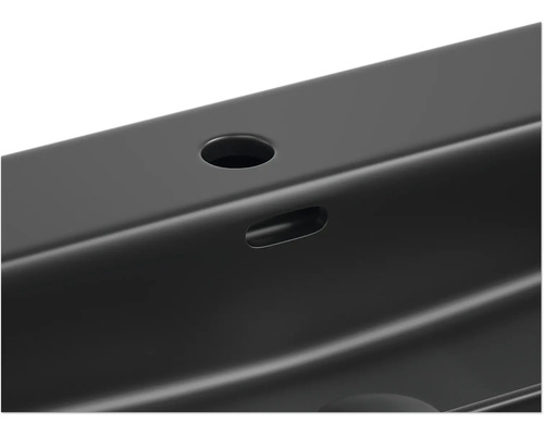 Imagine detaliată a unei chiuvete cu orificiu pentru robinet și preaplin