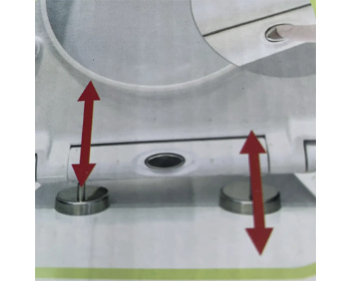 Detaliu al unui capac de toaletă cu mecanism de închidere lentă și săgeți roșii pentru a ilustra funcția