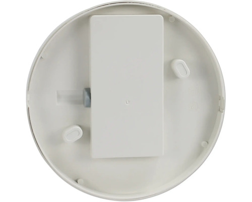 Partea inferioară a unui detector de fum cu compartiment pentru baterie